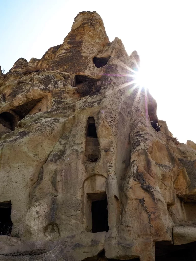 Rock-cut cave houses with sunrays 