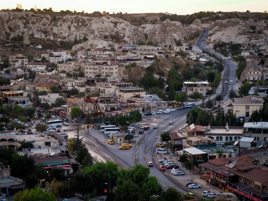 Town centre of Goreme in Cappadocia with a road running through the middle