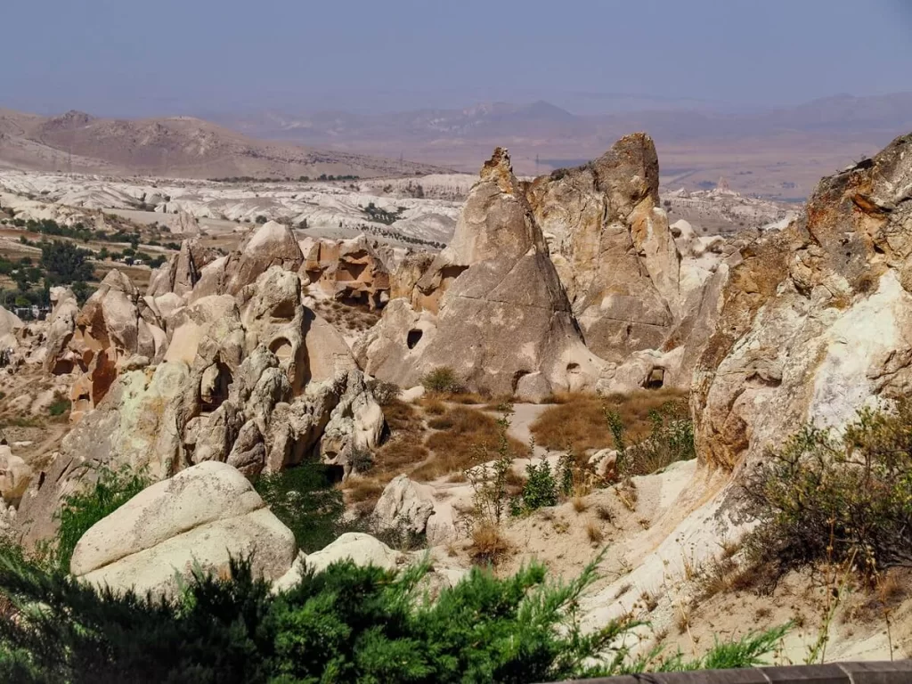 A valley of rock formations in Cappadocia