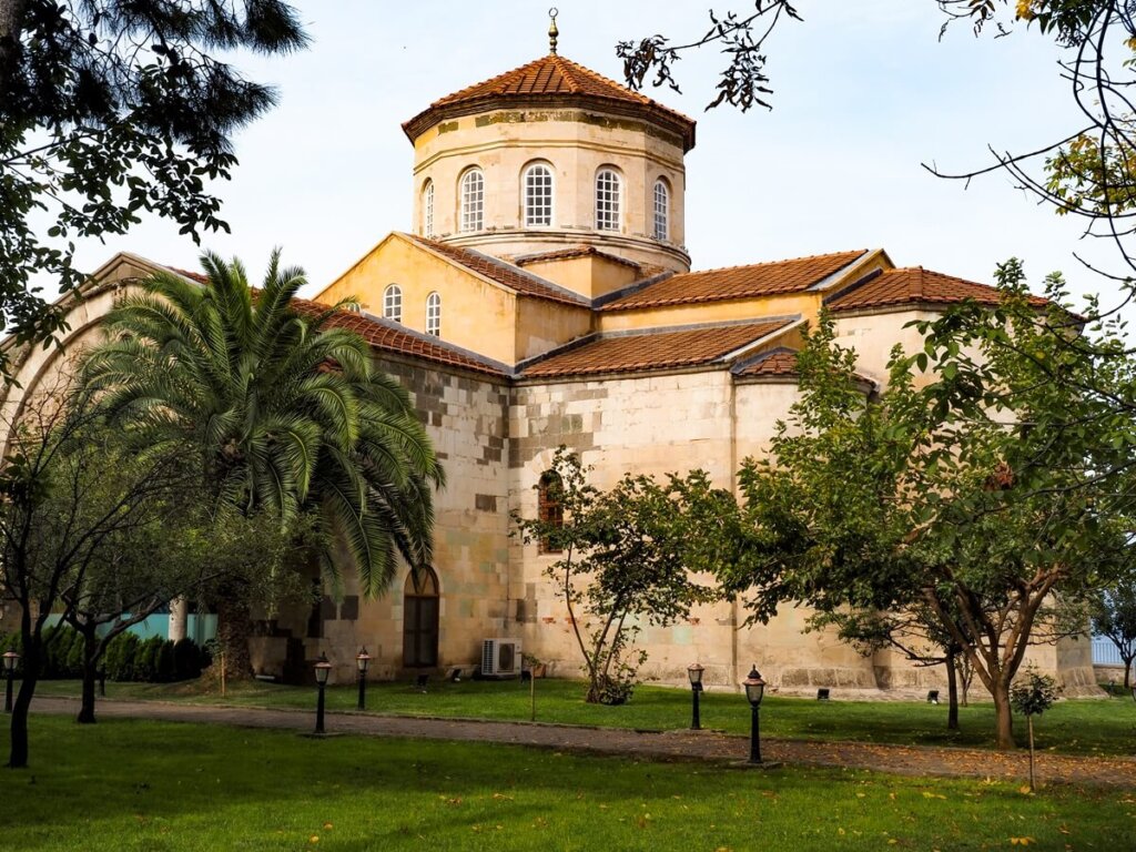 a late-Byzantine style building used as a museum and mosque in Trabzon Turkey with trees around it