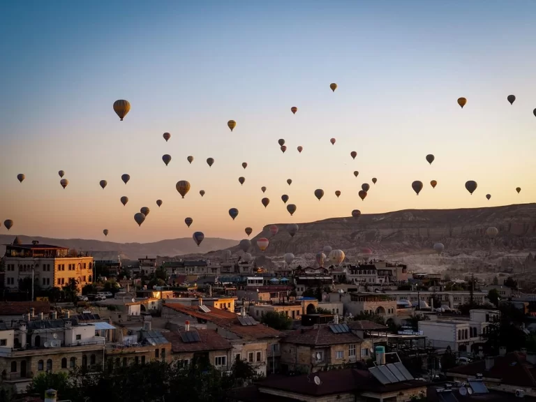 Hot air balloons in the sky during sunrise in Cappadocia