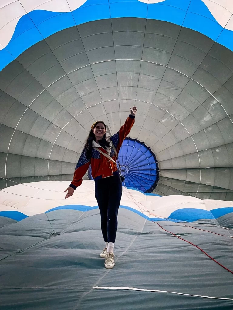 Female traveller is inside a hot air balloon