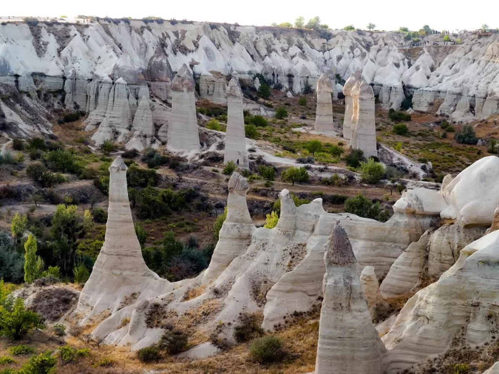 An open valley with white rock formations in Cappadocia