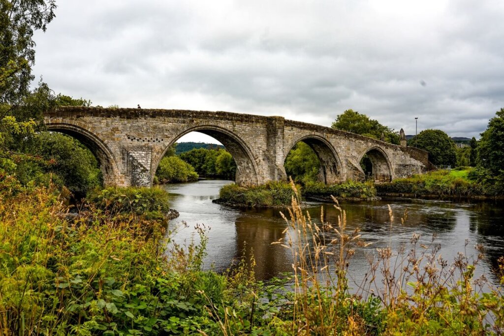 View of an old stone bridge across the river in Stirling Scotland