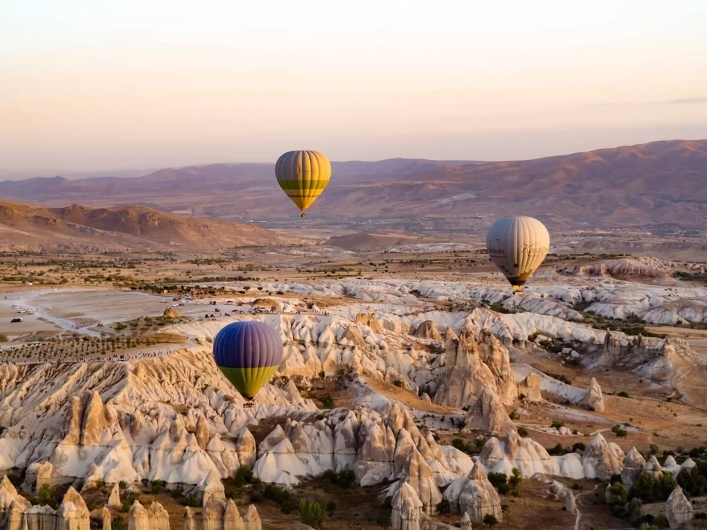 hot air balloons in the sky during sunrise in Cappadocia