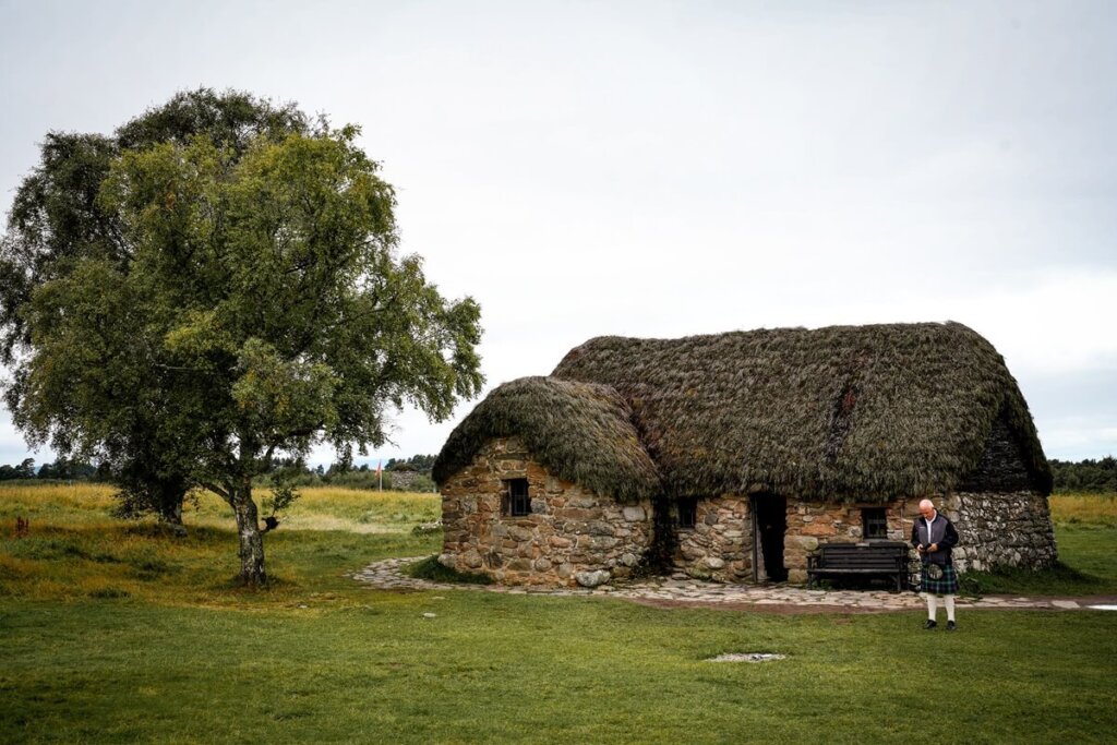 A house and a tree at Culloden Battlefield in Scotland