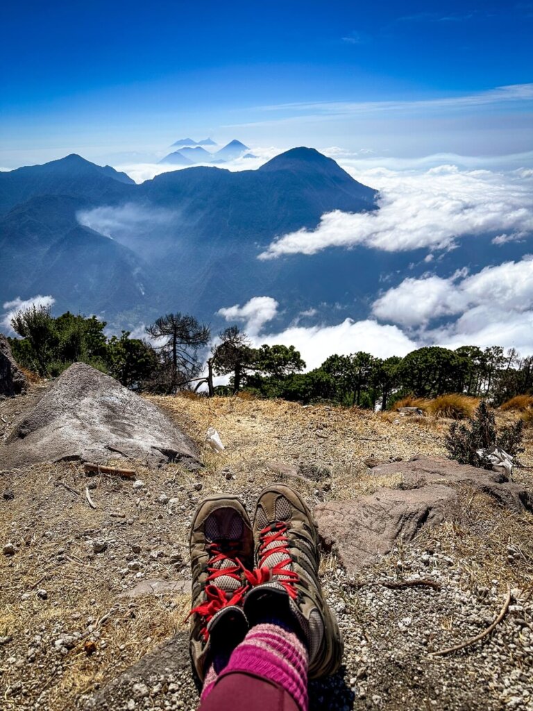A pair of hiking boots on top of a volcano in Guatemala