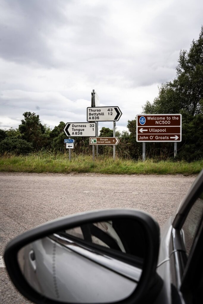 Road signs along the NC500 in Scotland