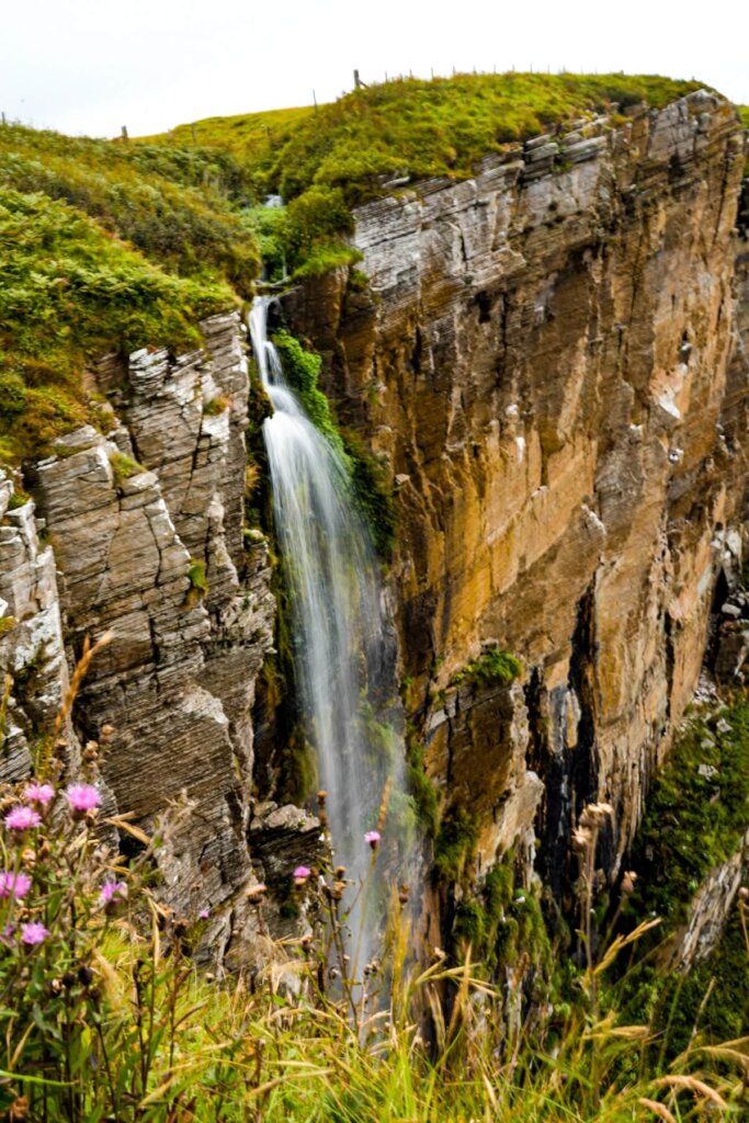 Waterfall at Whaligoe Steps in Scotland