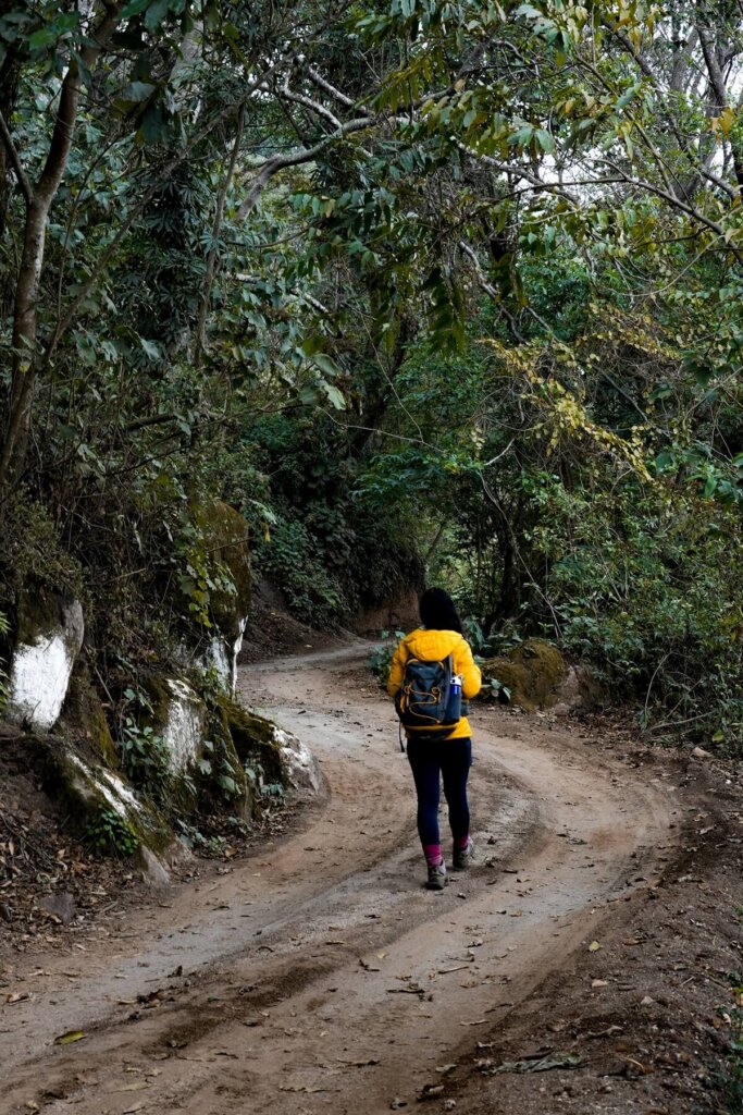 hiker is walking on a dirt track in Guatemala