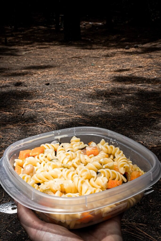 Pasta salad in a plastic tub