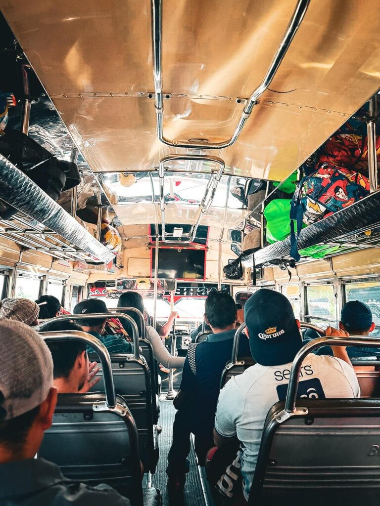 People sitting on a Chicken Bus in Guatemala