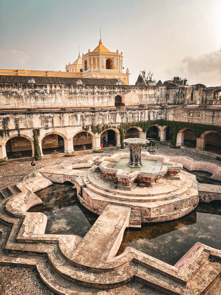 A huge fountain in the middle of a church ruin in Antigua Guatemala