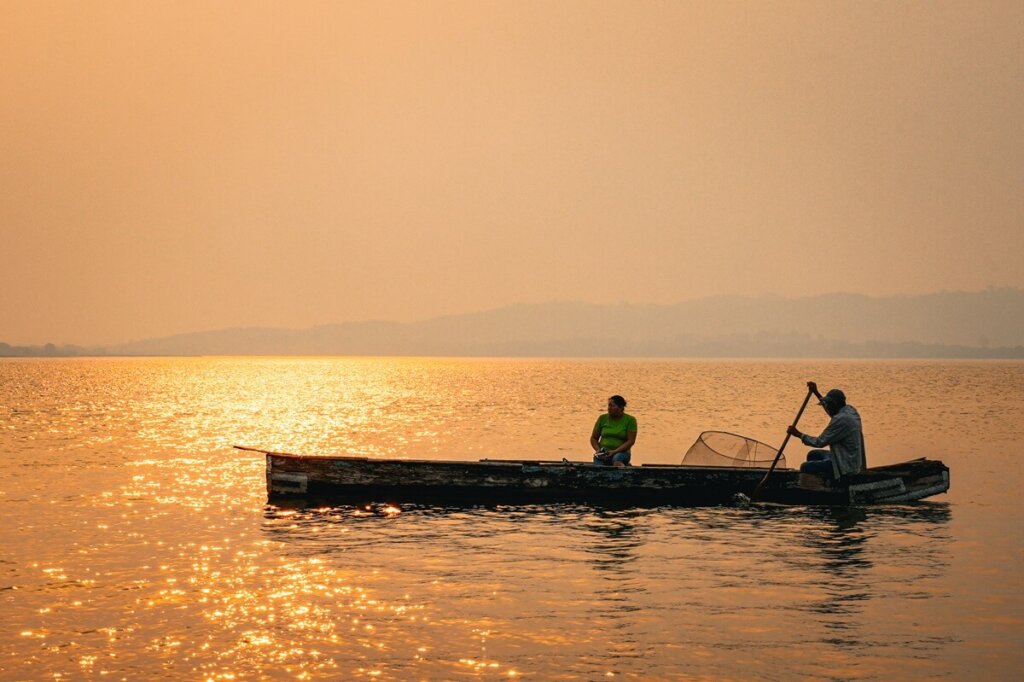 boat on Lake Peten Itza during sunset