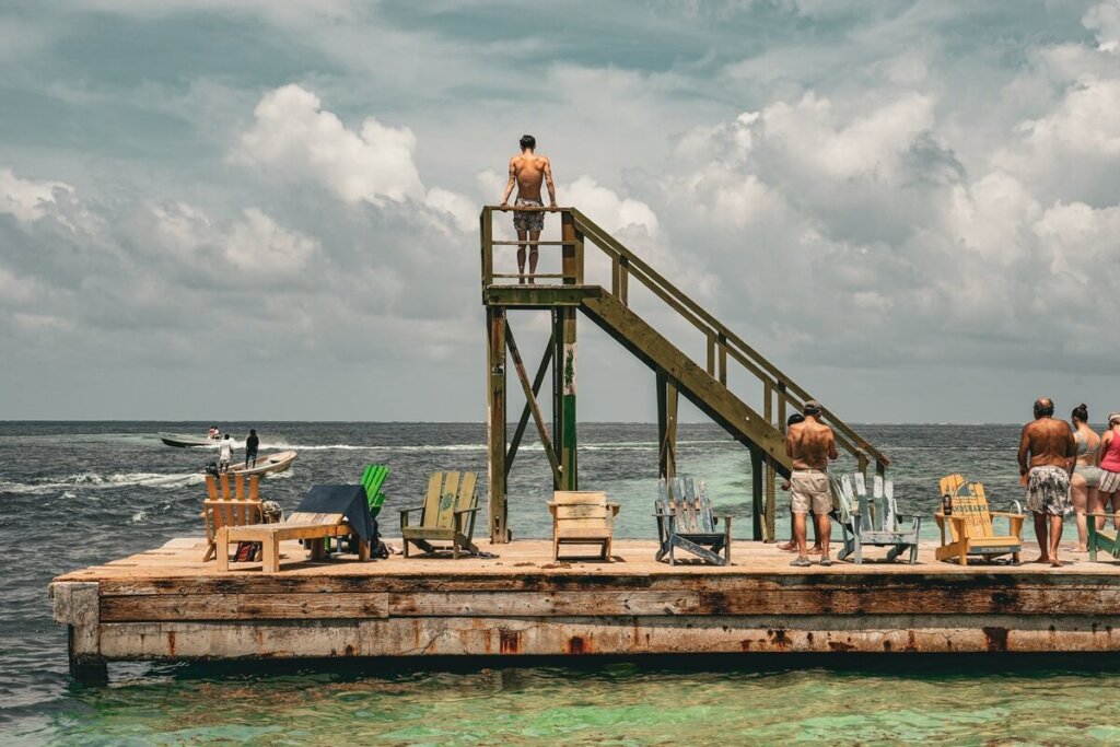 People standing on a pier in Caye Caulker