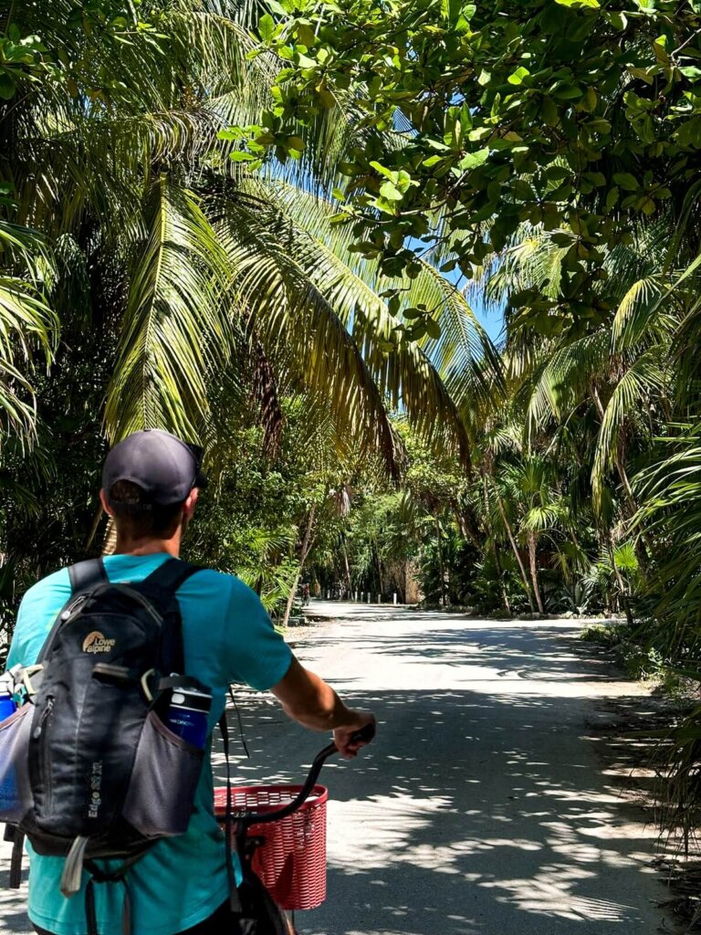 A guy cycling in Tulum Mexico