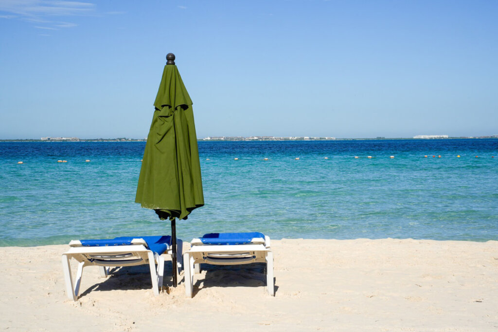 Beach chairs and umbrella on Playa Norte Isla Mujeres