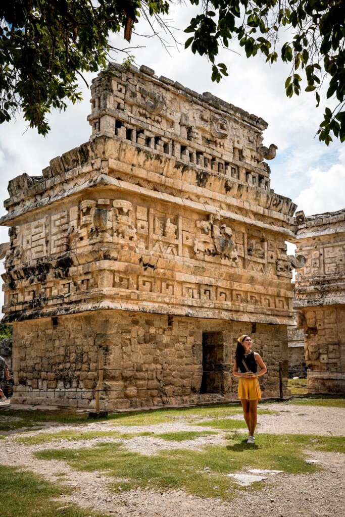Female is standing in front of an ancient Maya structure in Mexico